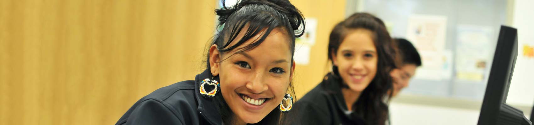 Smiling UUP student in a classroom